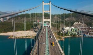 UAV survey aerial view of a suspension bridge and highway traffic supporting road and bridge construction projects in Phoenix