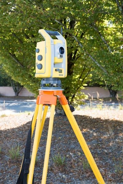 A topographic survey is essential for designing homes on sloped land, showing the challenges of construction on uneven terrain.