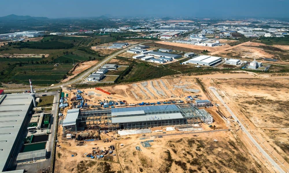 A wide aerial view of a large development site where a topographic survey would guide rezoning and early planning decisions