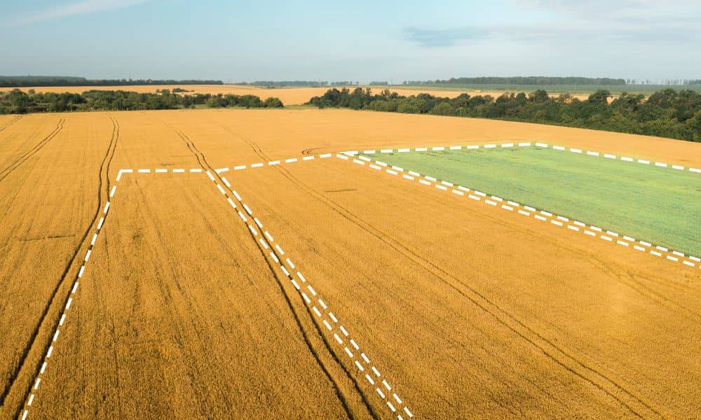 Aerial view of land with outlined property boundaries, showing how drone land surveying helps landowners see their parcels clearly